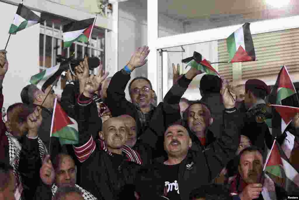 Turkish forensic officers prepare to remove a vehicle front of the US consulate in Istanbul. Police detained one man after he threatened to detonate a bomb he said he was carrying. Bomb experts discovered he was not carrying a bomb.