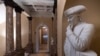 A statue of Benjamin Franklin is seen in an empty corridor outside the Senate at the Capitol in Washington, Dec. 27, 2018, during a partial government shutdown. 