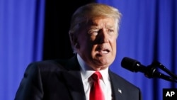 President Donald Trump, shown speaking at the Department of Homeland Security in Washington, Jan. 25, 2017, said on Twitter that he wanted a voter fraud probe to look at "those registered to vote in two states, those who are illegal and even those registered to vote who are dead."