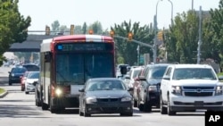 FILE - A connected traffic light is seen as part of an effort to improve safety and efficiency by allowing cars to communicate with the roadside infrastructure and one another, near Taylorsville, Utah. Sept. 6, 2024. 