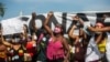 Demonstrators shouts slogans during a protest against the government's response in combating COVID-19, demanding the impeachment of President Jair Bolsonaro, in Rio de Janeiro, Brazil, May 29, 2021.