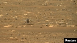 NASA's Mars helicopter Ingenuity makes its first flight on the planet, April 19, 2021. (NASA/JPL-Caltech/ASU/Handout via REUTERS)