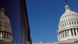 FILE - The U.S. Capitol dome and its reflection are seen in Washington, Jan. 15, 2020.