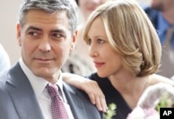 George Clooney and Vera Farmiga in scene from Up In The Air