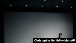 FILE - Filmmaker Bong Joon-Ho poses for a portrait at the Whitby Hotel screening room in New York to promote his film "Parasite," Oct. 8, 2019.