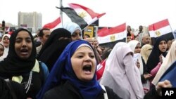 Egyptian anti-Mubarak protesters shout slogans as they march in Alexandria, Egypt, Saturday, Feb. 5, 2011