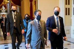 Rep. Jami Raskin (D-MD) and House Intelligence Committee Chairman Adam Schiff (D-CA) walk through the U.S. Capitol, as Democrats debate one article of impeachment against U.S. President Donald Trump, in Washington, Jan. 13, 2021.