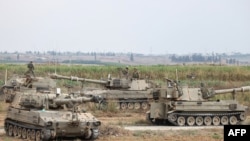 以色列军队装甲车辆在加沙地带边境地区集结。（2023年10月9日）