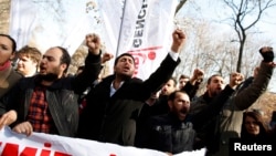 Protesters shout slogans against Turkey's Prime Minister Tayyip Erdogan during a demonstration in Ankara, Feb. 6, 2014. 