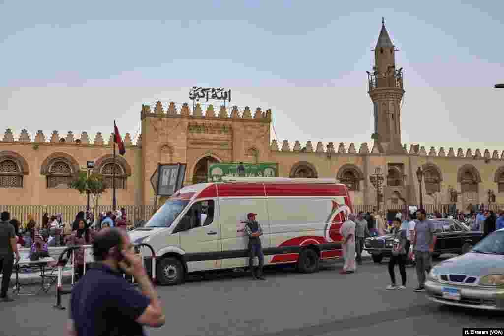 Ambulances wait to aid people who collapse from overcrowding and heat at Amr Ibn al-As mosque, in old Cairo, Egypt, May 31, 2019.