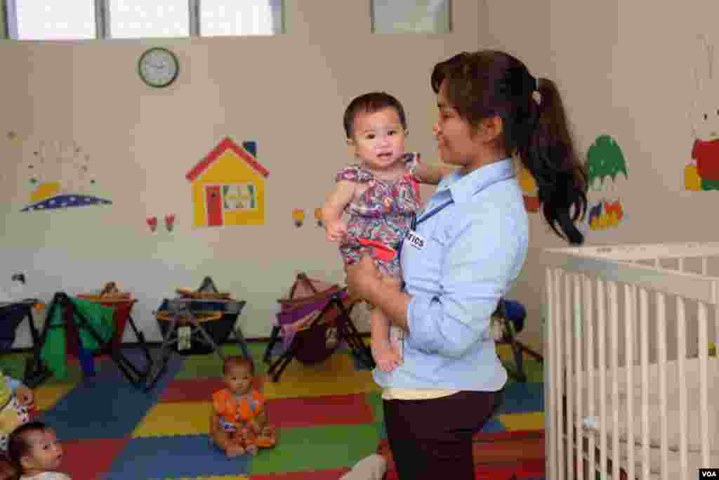 The factory offers day care so young mothers can continue their employment after a paid maternity leave. (S. Herman/VOA)