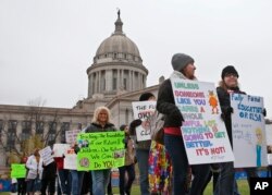 Teachers picket around the Oklahoma State Capitol in Oklahoma City, April 2, 2018, as teachers rally against low school funding.