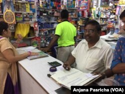 Store owner Vimal Jain in New Delhi, who like millions of shopkeepers, maintained records in ledgers and issued paper receipts, says the transition to GST will disrupt his business, just as the currency ban did last November.