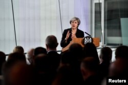 Britain's Prime Minister Theresa May delivers a speech at the Waterfront Hall in Belfast, Northern Ireland, July 20, 2018.