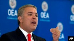 Colombian President Ivan Duque addresses the Organization of American States Permanent Council during an official visit at OAS's headquarters in Washington, Feb. 15, 2019. 