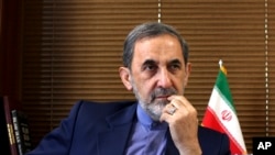 FILE - Ali Akbar Velayati, a top adviser to Iran's supreme leader Ayatollah Ali Khamenei, gives an interview to The Associated Press at his office in Tehran, Iran, Aug. 18, 2013. 