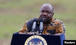 FILE - Gabon's President Ali Bongo addresses the media at Nairobi National Park near Nairobi, Kenya, April 30, 2016.