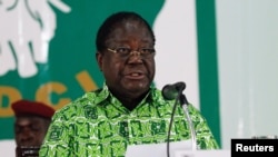 FILE - Former President Henri Konan Bedie speaks during his party's Parti Democratique de la Cote d'Ivoire (PDCI) meeting in Daoukro, Ivory Coast, Oct. 15, 2018.