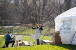Volunteers assemble sinks at the Samaritan's Purse field hospital in New York's Central Park, Wednesday, April 1, 2020.