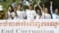 Social activists carry an anti-corruption banner during a rally in Phnom Penh, Cambodia, file photo. 