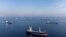 Commercial vessels including ships that are part of Black Sea grain deal wait to pass the Bosphorus strait off the shores of Yenikapi in Istanbul. (Reuters/Umit Bektas)