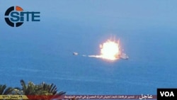 Photo posted on SITE intelligence group website appears to show an Egyptian frigate being hit by a rocket that Islamic State says it fired, July 16, 2015. (SITE)