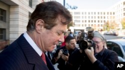 FILE - Paul Manafort, President Donald Trump's former campaign chairman, departs Federal District Court in Washington, Nov. 2, 2017. 