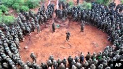 Refugees and migrants try to reach the shore on the Greek island of Lesbos, despite a rough sea, after crossing the Aegean Sea from Turkey. At least 17 children drowned when three boats sank en route, the latest tragedy to strike migrants braving wintry seas to seek asylum in Europe.