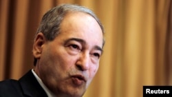 Wakil Menteri Luar Negeri Suriah Faisal al-Mekdad dalam konferensi pers di Damascus, Suriah, 10 Maret 2018. Al-Mekdad baru diangkat menjadi Menteri Luar Negeri menggantikan Walid Moalem yang wafat pekan lalu.