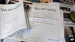Newspapers at a news vendor in central London, with the advertisement apology for News International, July 16, 2011. News Corporation chairman Rupert Murdoch signed the company advert entitled "We are sorry", which appears in British national newspapers.