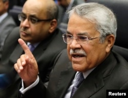 FILE - Saudi Arabian Oil Minister Ali al-Naimi talks to journalists before a meeting of OPEC oil ministers at OPEC's headquarters in Vienna, Nov. 27, 2014.
