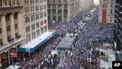 The New York Giants get a tickertape parade as they head up the Canyon of Heroes, Feb. 7, 2012 in New York.