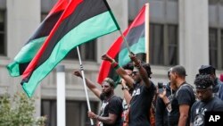 People participate in a rally against racism, injustice and white supremacy, in Perk Plaza, before the Republican National Convention in Cleveland, Ohio, July 16, 2016.