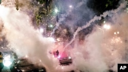 Smoke fills the sky as federal officers try to disperse protesters on July 22, 2020, in Portland, Ore. 
