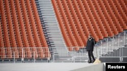 A worker is seen at the Olympic Stadium, venue for the opening and closing ceremonies of the 2018 Pyeongchang Winter Olympic Games in Pyeongchang, South Korea, Dec. 12, 2017.
