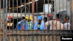 Ethiopian migrants prepare to leave an IOM shelter before they were flown back to Ethiopia, in Aden, Yemen, April 13, 2021. ,