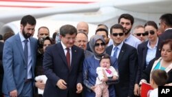 Freed Turkish hostages are welcomed at the airport in Ankara, Sept. 20, 2014.