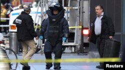 A member of the New York Police Department bomb squad is pictured outside the Time Warner Center in the Manhattan borough of New York City after a suspicious package was found inside the CNN Headquarters in New York, Oct. 24, 2018.