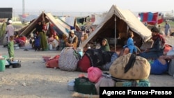 FILE - Afghan refugees rest in tents at a makeshift shelter camp in Chaman, a Pakistani town on the border with Afghanistan, Aug. 31, 2021.