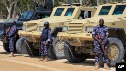 FILE - African Union (AU) soldiers stand with their armored vehicles near a checkpoint in Mogadishu, Somalia, Feb. 7, 2017. 
