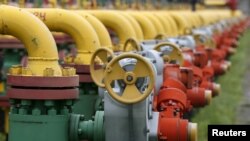 FILE - Pipes and valves are seen at an underground gas storage facility near Striy, Ukraine. Ukraine this week dismissed as unacceptable a natural gas transit proposal by Russian energy giant Gazprom, saying planned reductions in volume would yield amounts too small to make Russian gas transit economically viable. 
