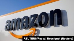 FILE PHOTO: The logo of Amazon is seen at the company logistics center in Boves, France, on August 8, 2018. (REUTERS/Pascal Rossignol)