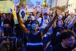 Demonstrators protest, Thursday, June 4, 2020, near the White House in Washington, over the death of George Floyd, a black man who was in police custody in Minneapolis. Floyd died after being restrained by Minneapolis police officers. (AP Photo/Evan…