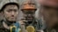 Ukrainian coal miners wait for a bus after exiting the underground of the Zasyadko mine in Donetsk, Ukraine, March 4, 2015.