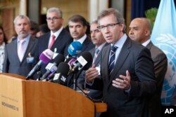 U.N. representative for Libya, Bernardino Leon, right, addresses reporters while Libyan parliaments members listen in Rabat, Morocco, Sept. 18, 2015.