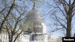 FILE - The U.S. Capitol building, currently under renovation, is seen in Washington April 11, 2015.