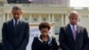 President Barack Obama, Attorney General Loretta Lynch, and Homeland Security Secretary Jeh Johnson stand for a moment of silence at the 34th Annual National Peace Officers Memorial Service, on the West Front of the Capitol in Washington, May 15, 2015.