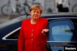 German Chancellor Angela Merkel arrives for a coalition meeting with the CSU and the SPD parties at the Reichstag in Berlin, Germany, July 5, 2018.