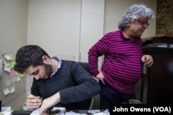 Khajag Barsoumian, left, and his father, Sarkis, work in the family business, in Beirut, Lebanon, Feb. 26, 2016. Unlike many of the younger Armenian generation, 19-year-old Khajag has decided to follow in his father's footsteps.