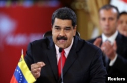 FILE - Venezuela's President Nicolas Maduro speaks during an ALBA alliance summit to mark fourth anniversary of the death of Venezuela's late President Hugo Chavez in Caracas, March 5, 2017.